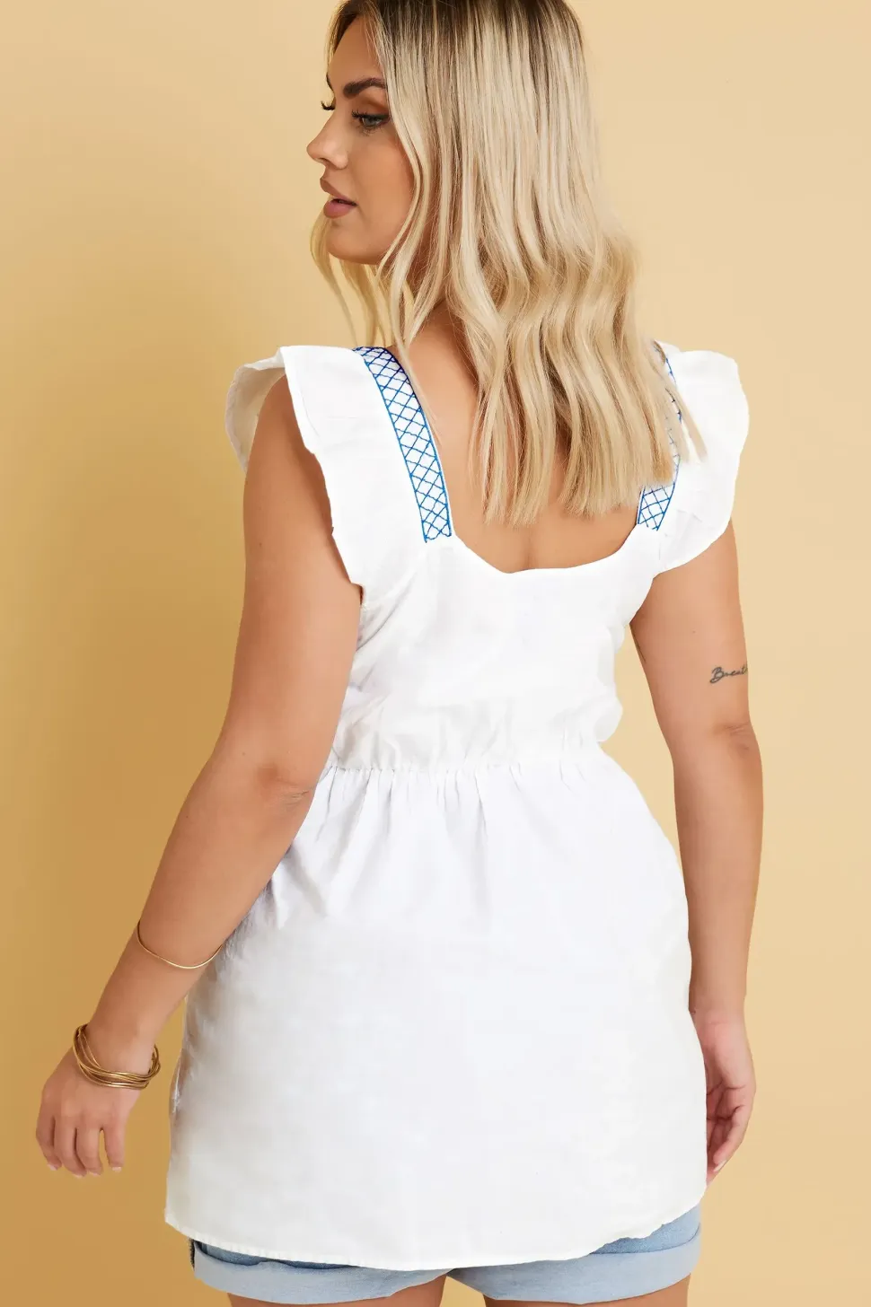 Embroidered Peplum Top