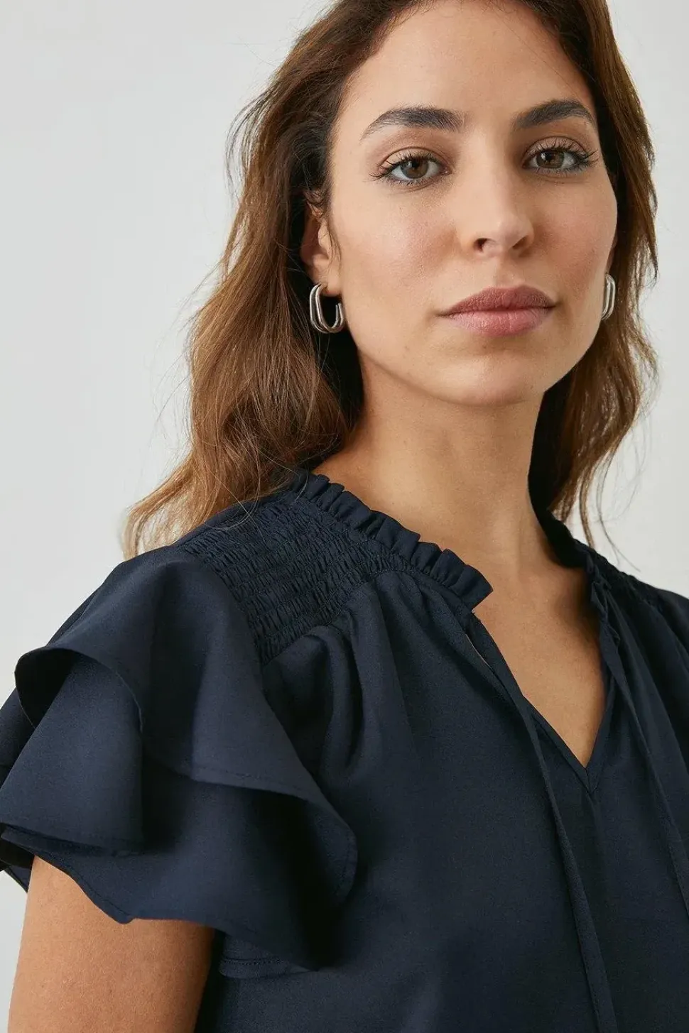 Navy Bubble Hem Flute Sleeve Top