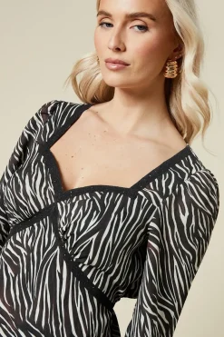 Zebra lace front long sleeve blouse